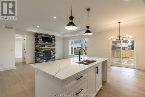 16 Bloomington Way, Chatham, ON - Indoor Photo Showing Kitchen With Fireplace With Double Sink