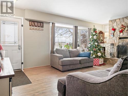 301 95 Avenue, Dawson Creek, BC - Indoor Photo Showing Living Room With Fireplace