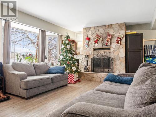 301 95 Avenue, Dawson Creek, BC - Indoor Photo Showing Living Room With Fireplace