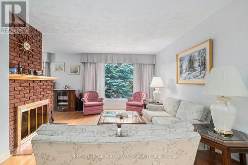 1253 Cobden Road, Ottawa, ON - Indoor Photo Showing Living Room With Fireplace