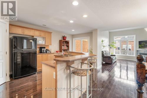 349 Grey Seal Circle, Ottawa, ON - Indoor Photo Showing Kitchen With Fireplace With Double Sink