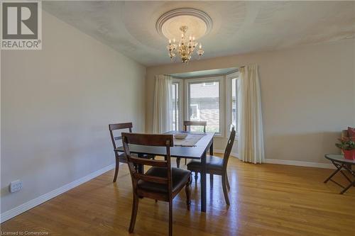 Dining room featuring a chandelier and wood-type flooring - 431 Northlake Drive, Waterloo, ON - Indoor Photo Showing Dining Room