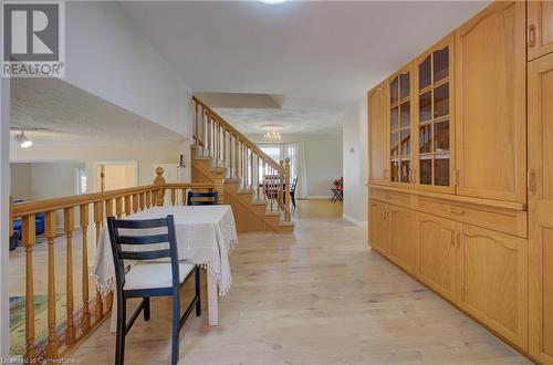 Hall with a notable chandelier, a healthy amount of sunlight, and light hardwood / wood-style floors - 431 Northlake Drive, Waterloo, ON - Indoor Photo Showing Other Room