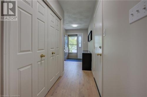 Hall with a textured ceiling and light hardwood / wood-style flooring - 431 Northlake Drive, Waterloo, ON - Indoor Photo Showing Other Room