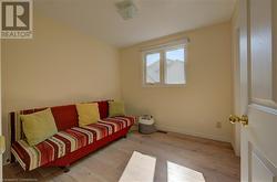 Living area with light wood-type flooring - 