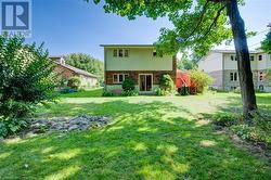 Back of property with a lawn - 