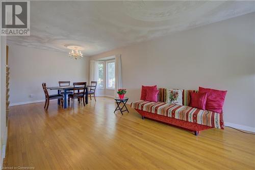 Dining room featuring a chandelier and light hardwood / wood-style flooring - 431 Northlake Drive, Waterloo, ON - Indoor