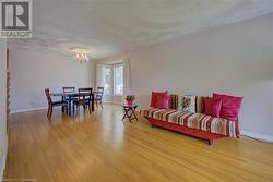 Dining room featuring a chandelier and light hardwood / wood-style flooring - 