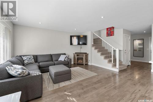 202 Stilling Union, Saskatoon, SK - Indoor Photo Showing Living Room With Fireplace