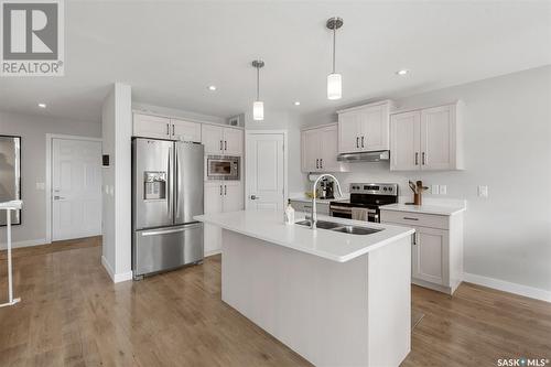 202 Stilling Union, Saskatoon, SK - Indoor Photo Showing Kitchen With Double Sink With Upgraded Kitchen