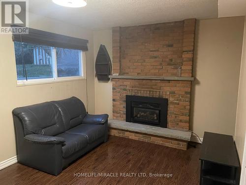 9 Hinchley Wood Grove, Brampton, ON - Indoor Photo Showing Living Room With Fireplace