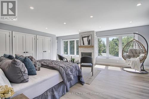 7580 16Th Side Road, King, ON - Indoor Photo Showing Bedroom With Fireplace