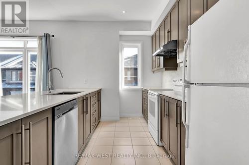 104 - 30 Time Square Boulevard, Hamilton, ON - Indoor Photo Showing Kitchen With Upgraded Kitchen