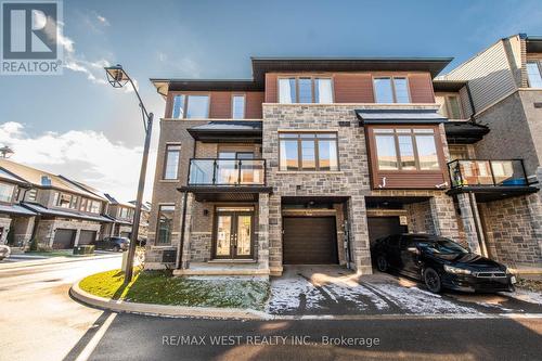 104 - 30 Time Square Boulevard, Hamilton, ON - Outdoor With Balcony With Facade