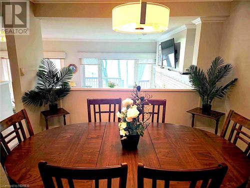 Dining area overlooking the sunken living room - 555 Main Street S Unit# 5, Callander, ON - Indoor Photo Showing Dining Room