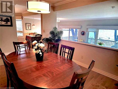 Dining area with hardwood / wood-style floors and ornamental molding - 555 Main Street S Unit# 5, Callander, ON - Indoor Photo Showing Dining Room