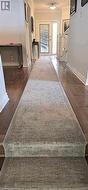 Hall featuring crown molding and dark wood-type flooring - 