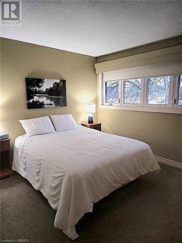 Bedroom with view of the Bay - 555 Main Street S Unit# 5, Callander, ON - Indoor Photo Showing Bedroom