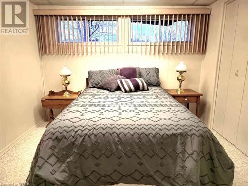 Lower level Bedroom with carpet flooring and full closet - 555 Main Street S Unit# 5, Callander, ON - Indoor Photo Showing Bedroom