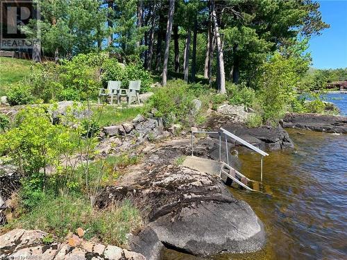 Steps for entering the water for a swim - 555 Main Street S Unit# 5, Callander, ON - Outdoor With Body Of Water With View