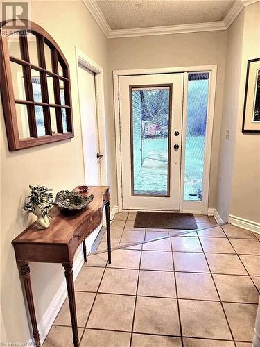 Doorway to outside, side entry from the garage, coat closet and powder-room - 555 Main Street S Unit# 5, Callander, ON - Indoor Photo Showing Other Room