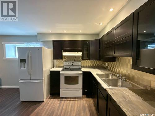 916 Athol Street, Regina, SK - Indoor Photo Showing Kitchen With Double Sink