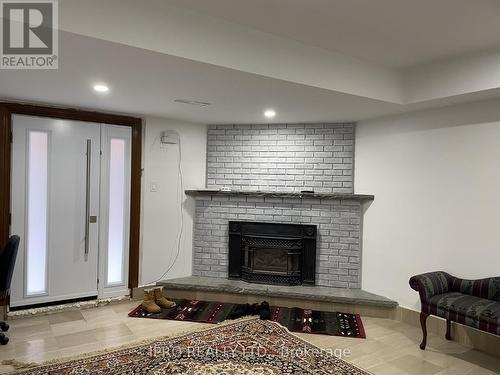 Bsmt - 19 St. Andrews Boulevard, Toronto, ON - Indoor Photo Showing Living Room With Fireplace