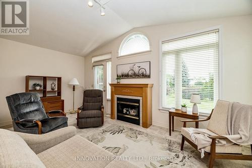 8 Nighthawk Crescent, Ottawa, ON - Indoor Photo Showing Living Room With Fireplace