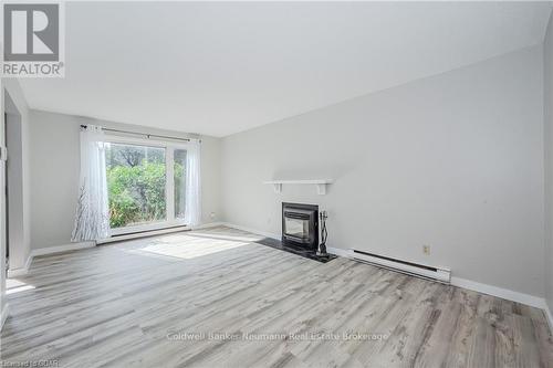 85 - 360 Scottsdale Drive, Guelph (Hanlon Creek), ON - Indoor Photo Showing Living Room With Fireplace