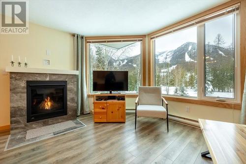 4559 Timberline Crescent Unit# 128, Fernie, BC - Indoor Photo Showing Living Room With Fireplace