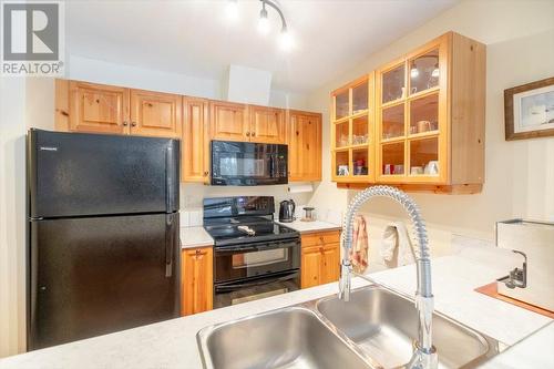 4559 Timberline Crescent Unit# 128, Fernie, BC - Indoor Photo Showing Kitchen With Double Sink