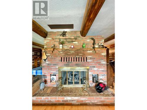 4050 Spokin Lake Road, 150 Mile House, BC - Indoor With Fireplace