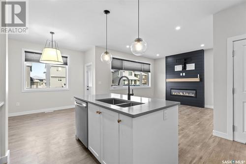 131 Barrett Street, Saskatoon, SK - Indoor Photo Showing Kitchen With Fireplace With Double Sink