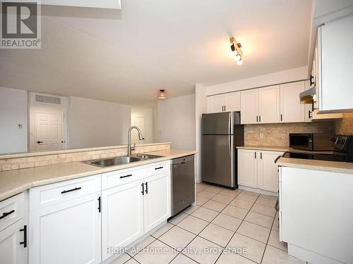 204 - 2301 Parkhaven Boulevard, Oakville (Uptown Core), ON - Indoor Photo Showing Kitchen With Double Sink