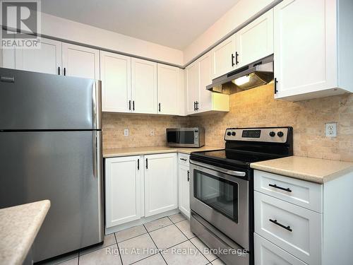 204 - 2301 Parkhaven Boulevard, Oakville (Uptown Core), ON - Indoor Photo Showing Kitchen With Stainless Steel Kitchen