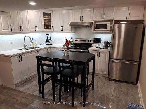 B-629 Dolly Bird Lane, Mississauga, ON - Indoor Photo Showing Kitchen With Double Sink