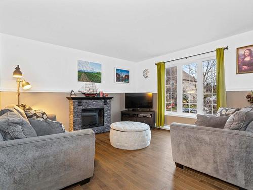 Living room - 85 Rue De La Colonelle, Saint-Jean-Sur-Richelieu, QC - Indoor Photo Showing Living Room With Fireplace