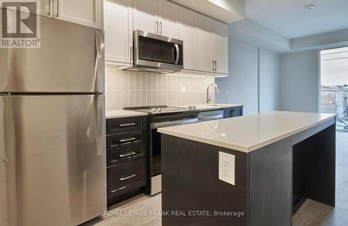 335 - 201 Brock Street S, Whitby (Downtown Whitby), ON - Indoor Photo Showing Kitchen With Stainless Steel Kitchen