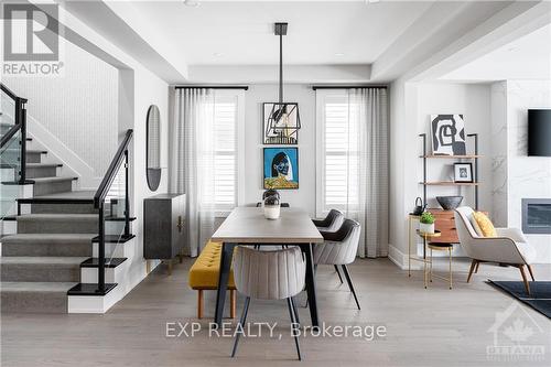 153 Robert Perry Street, North Grenville, ON - Indoor Photo Showing Dining Room With Fireplace