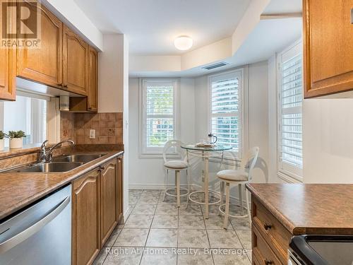 209 - 2301 Parkhaven Boulevard, Oakville (Uptown Core), ON - Indoor Photo Showing Kitchen With Double Sink