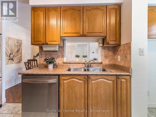 209 - 2301 Parkhaven Boulevard, Oakville (Uptown Core), ON - Indoor Photo Showing Kitchen With Double Sink