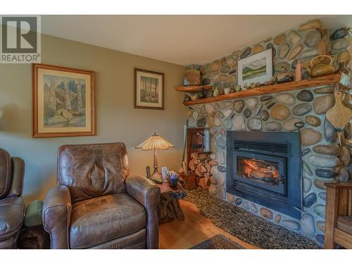 5208 Davis Road, 108 Mile Ranch, BC - Indoor Photo Showing Living Room With Fireplace