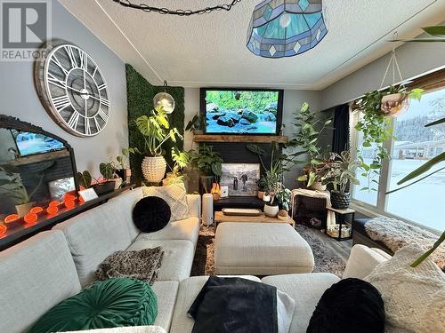 1173 Yorston Avenue, Quesnel, BC - Indoor Photo Showing Living Room With Fireplace