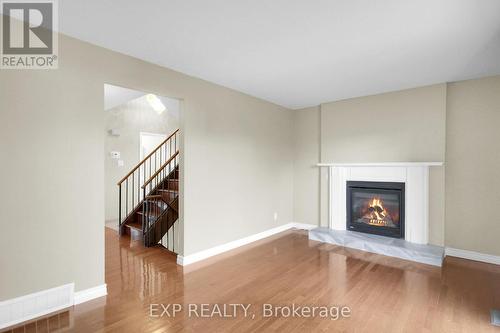 8 Henfield Avenue, Ottawa, ON - Indoor Photo Showing Living Room With Fireplace