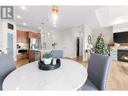 1107 Syer Road, Penticton, BC - Indoor Photo Showing Dining Room With Fireplace