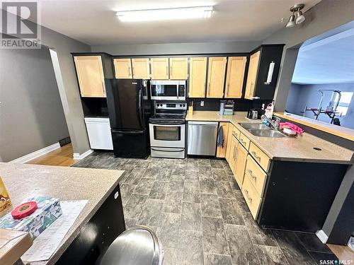 748 Brimacombe Drive, Weyburn, SK - Indoor Photo Showing Kitchen With Double Sink