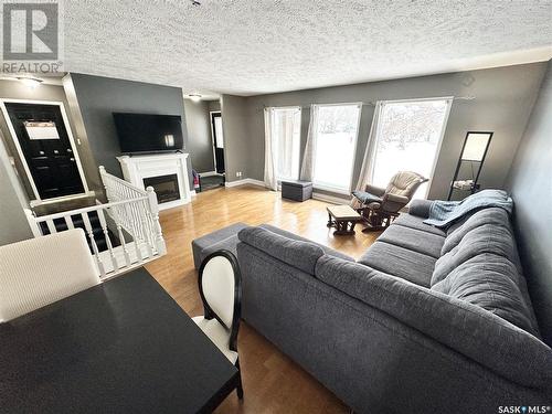 748 Brimacombe Drive, Weyburn, SK - Indoor Photo Showing Living Room With Fireplace