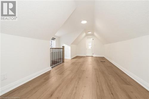 Bonus room featuring light wood-type flooring and lofted ceiling - 45 Munroe Street, Hamilton, ON - Indoor Photo Showing Other Room