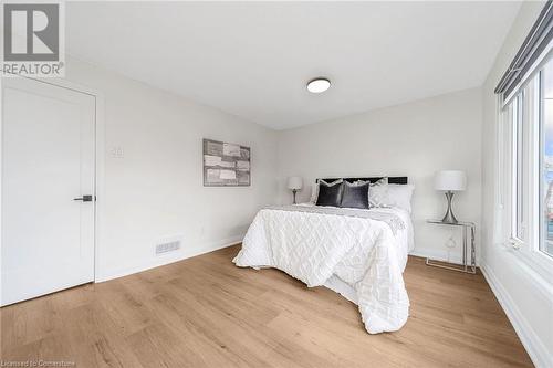 Bedroom featuring hardwood / wood-style flooring - 45 Munroe Street, Hamilton, ON - Indoor Photo Showing Bedroom