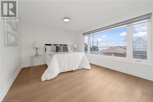 Bedroom featuring hardwood / wood-style floors - 45 Munroe Street, Hamilton, ON - Indoor Photo Showing Bedroom